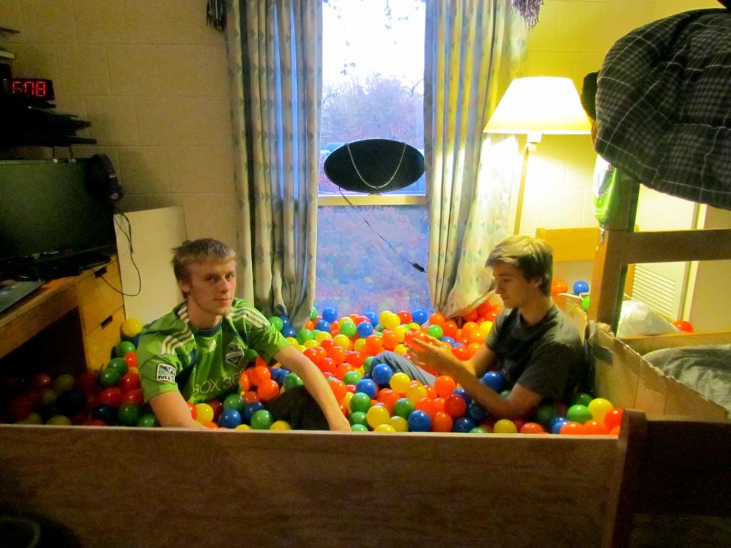Weinberg freshman Casey Kendall and Bienen freshman Jon Bauerfield, roommates in 1835 Hinman, talk to each other in their newly installed ball pit. The pit has attracted people to their room and helped them meet other new students.