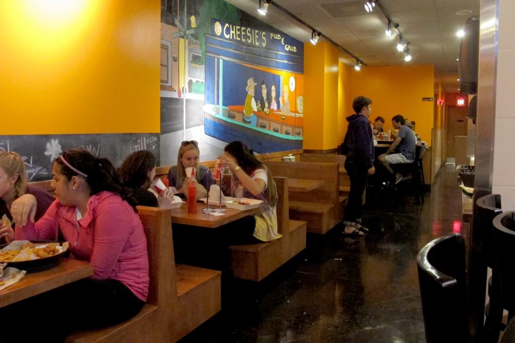 Northwestern students dine at Cheesie’s. The Davis Street restaurant has become a popular spot for students, given the few Evanston restaurants that stay open late.