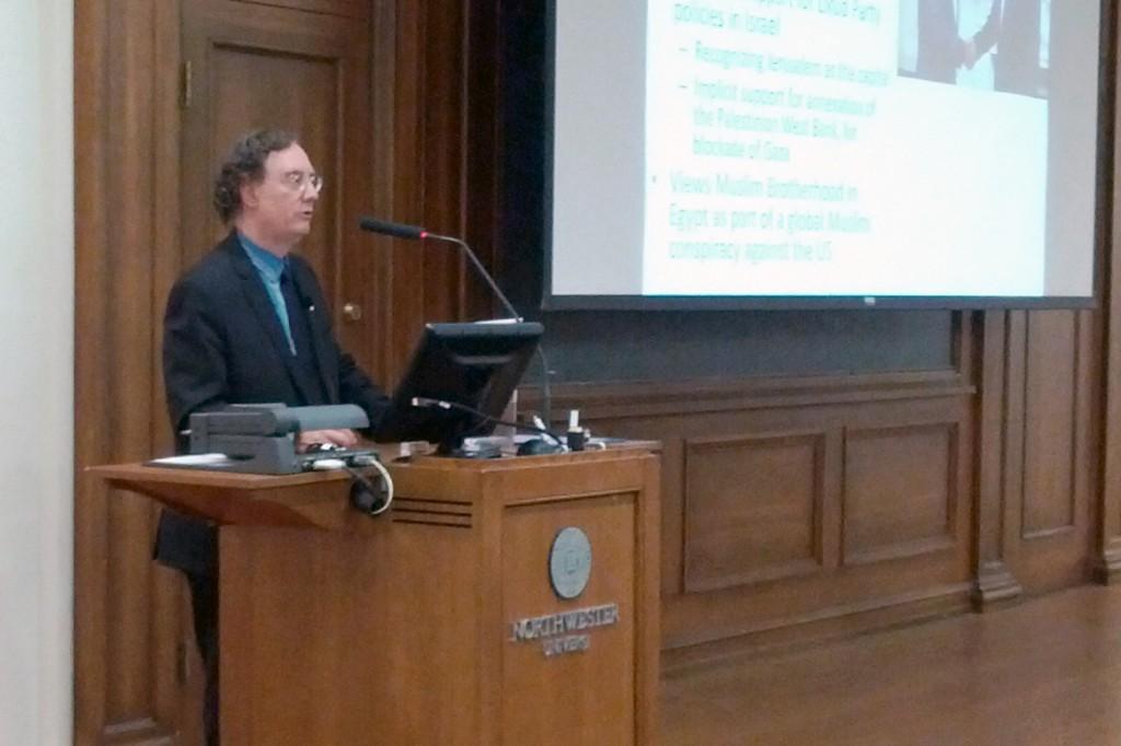 University of Michigan professor and historian Juan Cole discusses foreign policy in the Middle East in Harris Hall on Monday night. Cole, an expert on the modern Middle East and South Asia, contrasted the presidential candidates’ foreign policy views. 