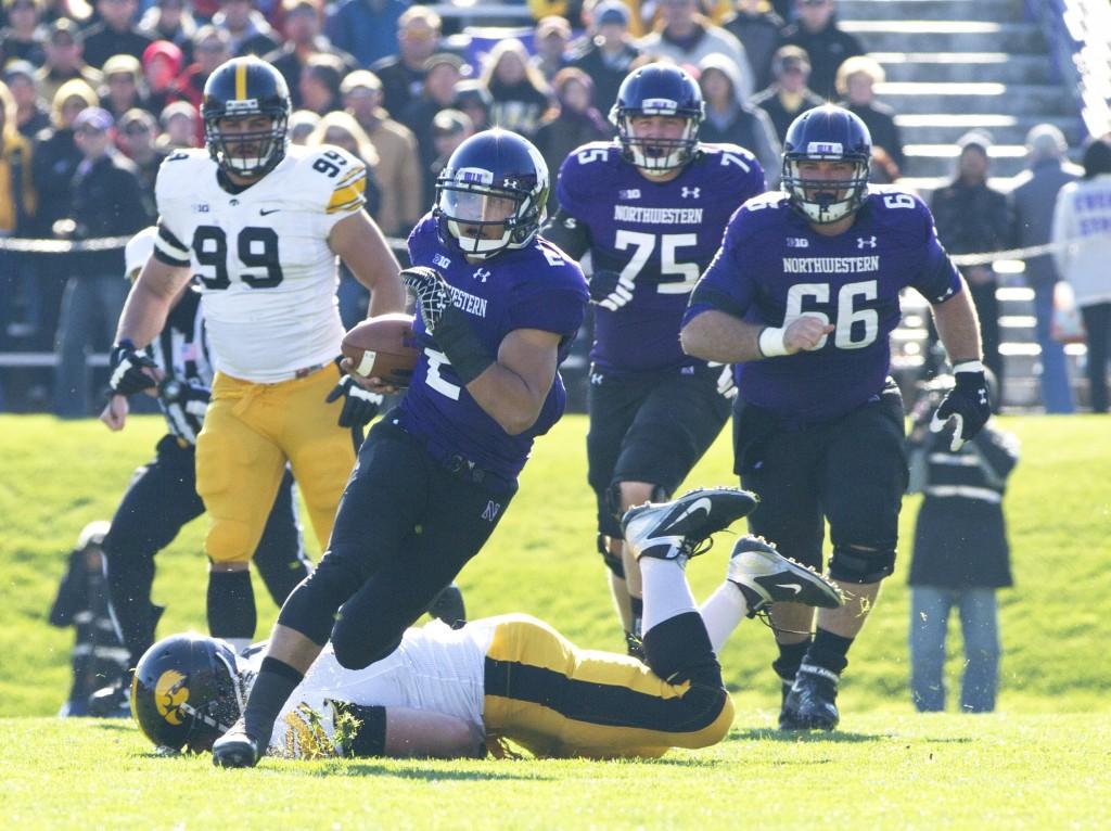 Northwestern quarterback Kain Colter leads the Wildcats to a touchdown on their opening drive against Iowa, gaining multiple first downs. He led the team with 166 yards rushing and scored three touchdowns. 