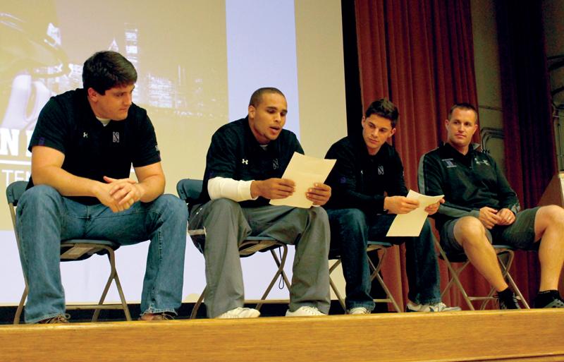 Speakers at Wildside 101 are, from left, senior offensive lineman Brian Mulroe, junior quarterback Kain Colter, junior kicker Jeff Budzien, and coach Pat Fitzgerald. Wildside 101 featured a panel where the audience asked the coach and players questions about Northwestern’s football team.