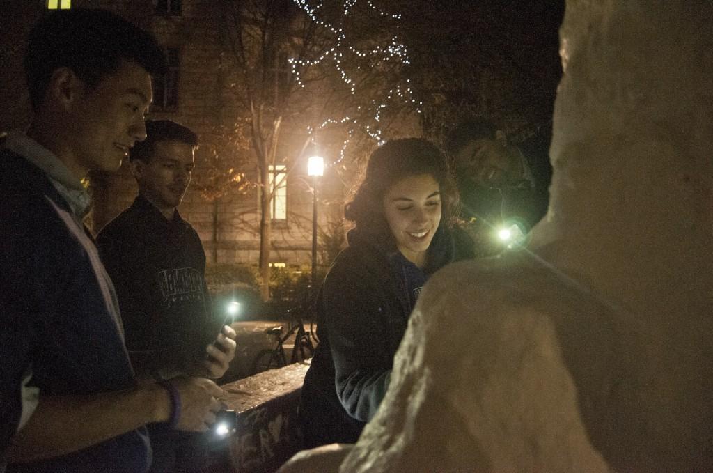 Associated Student Government president Victor Shao and ASG members Ethan Romba, Carly Blumenfeld and Ani Ajith paint The Rock, marking the end of the 13-day hiatus on decorating the campus landmark. Shao initiated the two-week hiatus after the funeral for McCormick sophomore Harsha Maddula, whose body was found in Lake Michigan last month.