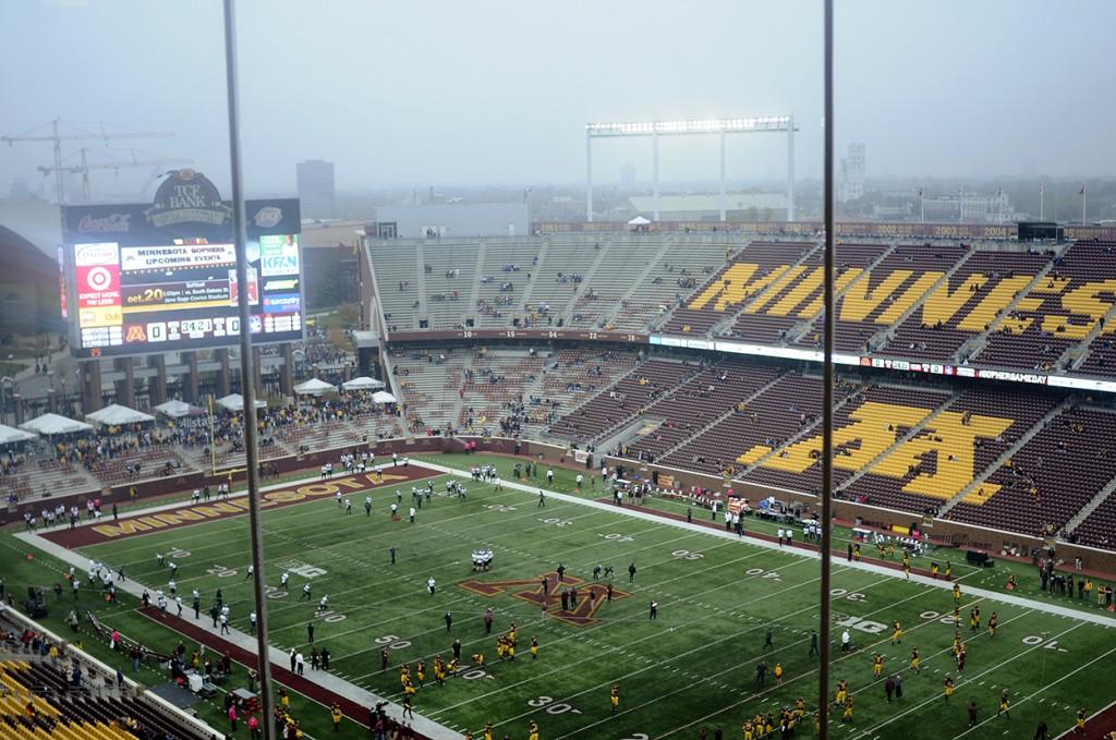 Players and fans prepare for the game in Minnesota as storm clouds loom over the stadium.