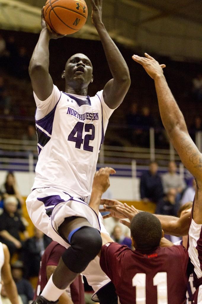 Northwestern Chier Ajou attempts a layup during Tuesday’s game against Texas Southern. The seven-foot-two-inch center is positioned to be a major contributor to the Cats this season.