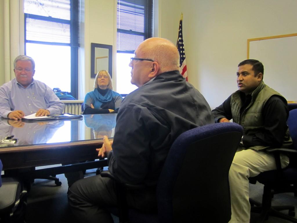 7-Eleven field consultant Mike Drop (second from right) and franchisee Prakash Mohanty (far right) state their case to the citys Liquor Control Board for serving alcoholic beverages at Mohantys store on Emerson Street.