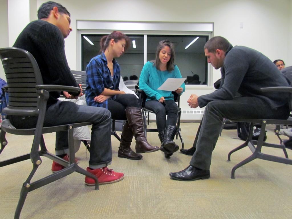 Anthony Iglesias,  Lucy Liu, Talia Romo, and Sergio Alvarez talk in their group about a sexual assault scenario. The small group discussions were an effort to get students to verbalize their opinions on the topic.