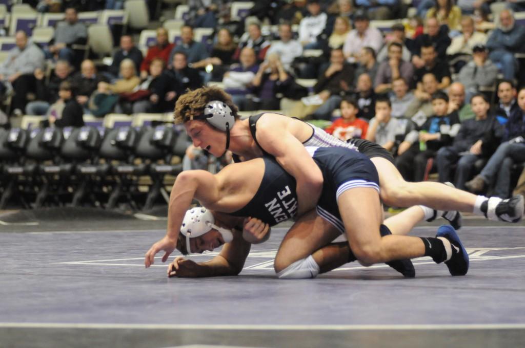 Redshirt senior Jason Welch establishes position on Penn State’s Dylan Alton during a January dual in Evanston. Welch and Alton will renew their rivalry at the NWCA All-Star Classic on Saturday. 