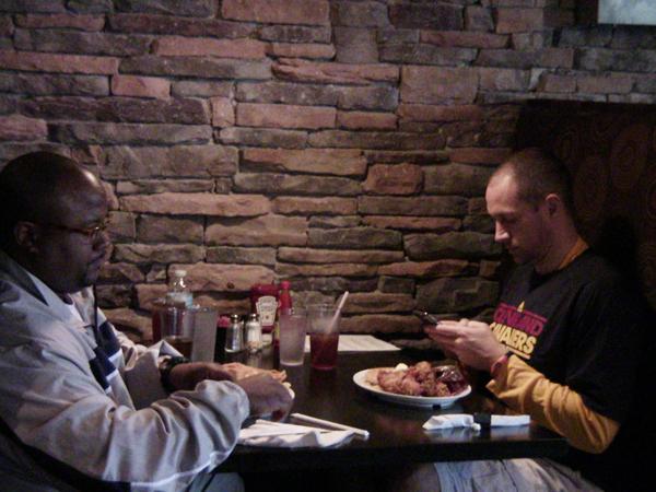Michael Johnson (left), director of the Evanston Township High School’s Pride Feeder basketball program, said that he has been to Chicago’s Home of Chicken & Waffles multiple times since it opened last Friday.