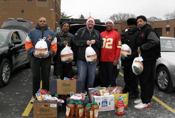 Tracey Wallace, (third from right), created the new group Black Men Against Violence in the aftermath of recent homicides in Evanston. The group has met several times and organized a Christmas Dinner Delivery program for the holidays.