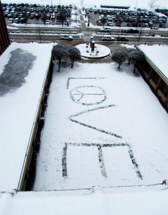 Evanston Township High School students spelled out the word love on school grounds Friday. District 202 Superintendent Eric Witherspoon approved the students request to spell out the word after school officials discovered the word f----t spelled out in the snow Thursday morning.