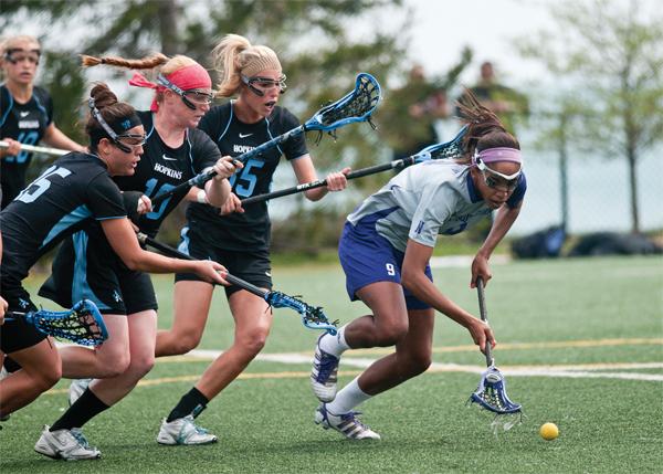 Taylor Thornton picks up a ground ball. Thornton, the reigning national player of the year, and the Wildcats are going for their eighth national title in nine years.