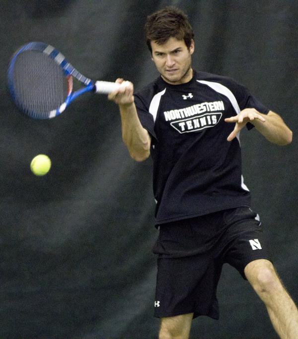 Senior Chris Jackman plays a shot. The Wildcats won both their matches over the weekend.