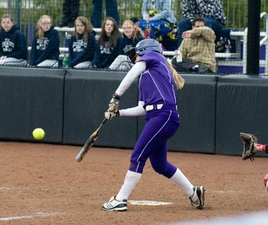 Sophomore Anna Edwards takes a swing. The Wildcats won two games over the weekend before their third was cancelled.
