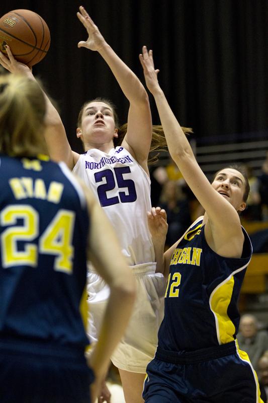 Freshman forward Maggie Lyon attempts a shot. Lyon led the Wildcats with 18 points in their loss to Michigan on Thursday. 