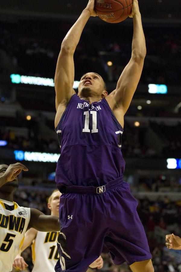 Senior guard Reggie Hearn goes up for a shot. Hearn scored 19 points and pulled down 10 rebounds, notching a double-double in his final game in purple.