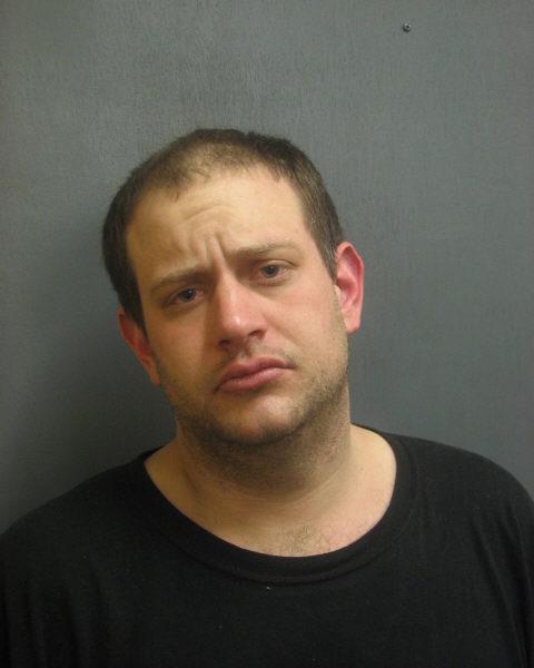Evanston Police arrested Richard Latoria, pictured, and Ryan Hanley on Friday after finding the men with a plastic bags filled with severed copper down spouts. EPD is still determining whether or not the three copper thefts associated with these men are related to other copper thefts around the city in the past two months.
