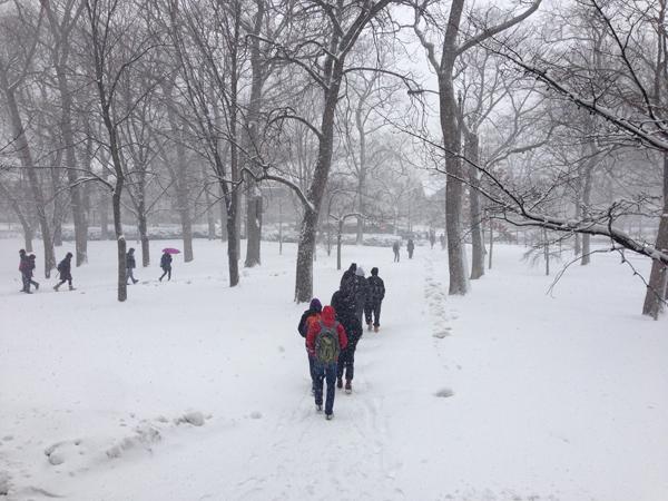 Northwestern students walk toward Sheridan Road in the midst of the Tuesday snow storm. The National Weather Service forecasted 7 to 10 inches of snow from the storm.