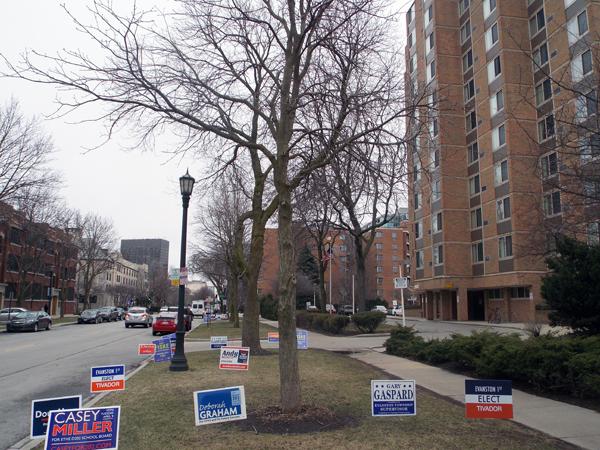 Yard signs of District 202 school board candidates fill a lawn outside 1900 Sherman Ave. Bill Geiger, Gretchen Livingston, Doug Holt and Patricia Savage-Williams won the election. 