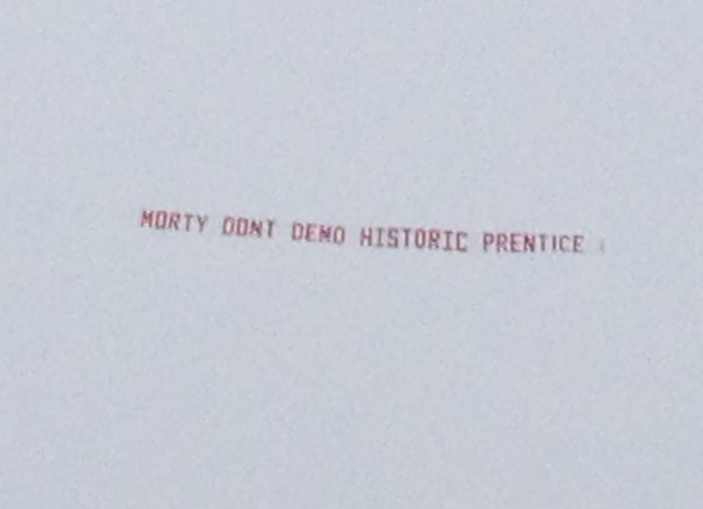 A banner reading MORTY DONT DEMO HISTORIC PRENTICE flies over Northwesterns commencement ceremony Friday morning at Ryan Field. University spokesman Al Cubbage said it was disappointing someone decided to push the message during a day of celebration for the NU community.