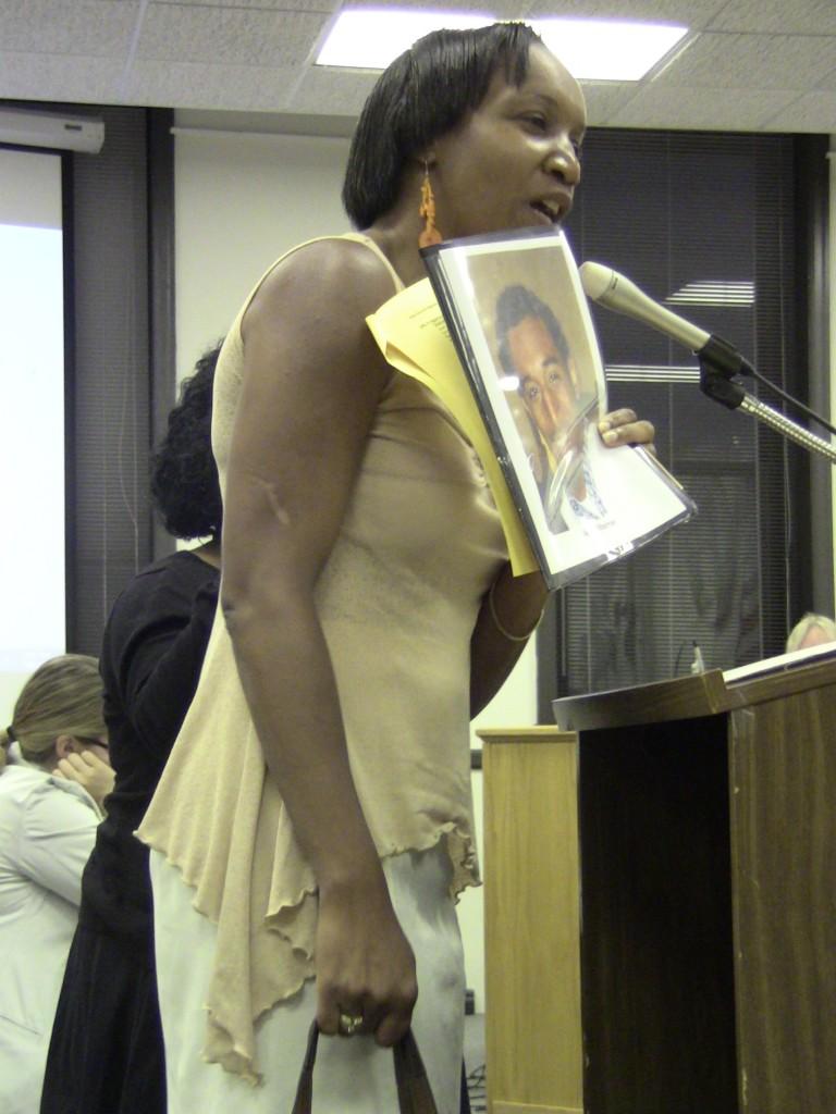 Carolyn Murray, mother of slain Evanston teen Justin Murray, encourages City Council to pass an assault weapons ban Monday night. Aldermen chose to wait until next week to make a decision on the ban.
