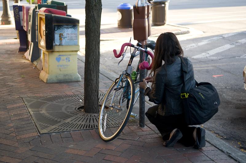 The city has created yellow bands that will be wrapped around bike locks attached to sign posts and street lights, among other objects beside bike racks. Suzette Robinson, director of the Public Works Department, proposed the bands.