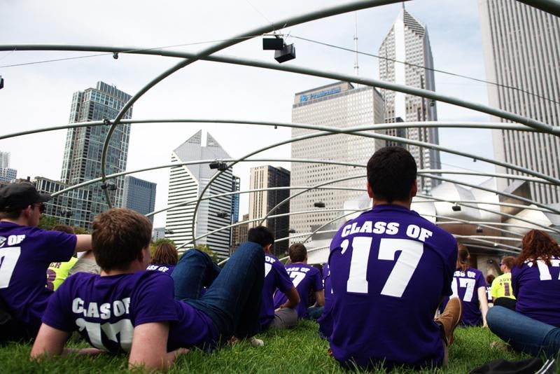 New students sit on The Great Lawn at Millennium Park on the second day of Wildcat Welcome. The event, Purple Pride, was one of several new activities introduced this year.
