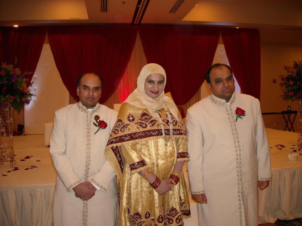 (From left to right) Azim, Farheen and Mobeen Hakeem pose together at a wedding in an undated photo. Azim and Mobeen Hakeem were shot to death July 30 in their downtown Evanston business.