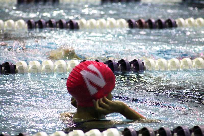 A+swimmer+adjusts+her+cap+at+the+swim-a-thon.+Wednesdays+event+drew+participants+from+organizations+including+Northwestern+athletic+teams+and+local+swimming+organizations.