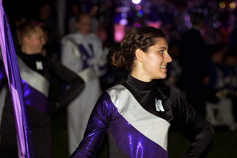 Weinberg+sophomore+Michelle+Lortie%2C+a+member+of+the+Northwestern+University+Marching+Band%E2%80%99s+color+guard%2C+performs+during+the+Homecoming+pep+rally+Friday+evening.+University+President+Morton+Schapiro%2C+football+Coach+Pat+Fitzgerald+and+Homecoming+grand+marshal+Mike+Greenberg+%28Medill+%E2%80%9889%29+pumped+up+fans+during+the+pep+rally.%0D%0A