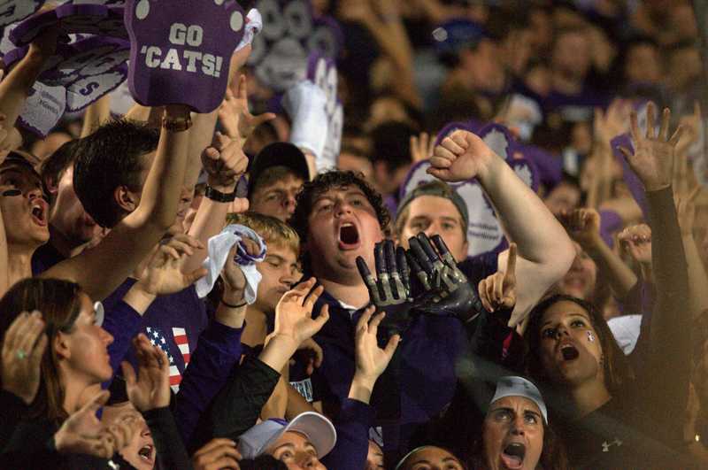 Northwestern fans cheer on the Wildcats at Ryan Field during Saturday’s matchup with Ohio State. The athletic department debuted a new pricing model for high-demand games for last weekend’s prime-time matchup. 