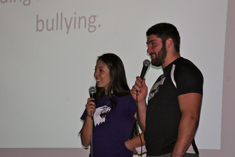 Senior softball player Marisa Bast and sophomore football player Max Chapman speak with students at Haven Middle School. Bast and Chapman are two of 25 student athletes participating in ROARR, a community outreach program intended to raise awareness about bullying.