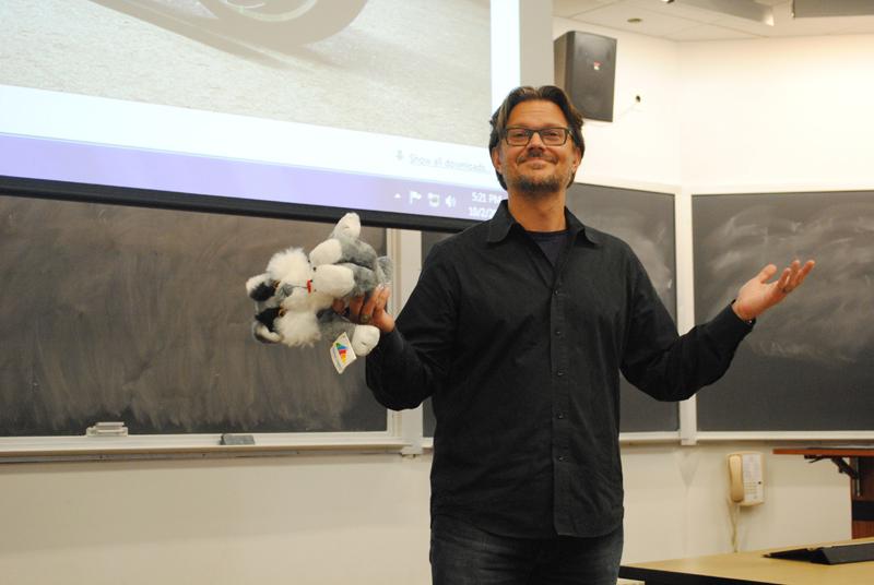 Mark-Hans Richer (Weinberg ‘89) speaks Wednesday while holding a Willie the Wildcat stuffed animal. Richer shared stories of his time at Northwestern, including his invention of the stuffed animal when he needed a gift to bring home to his sister.