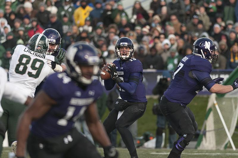 Northwestern+junior+quarterback+Trevor+Siemian+drops+back+to+pass.+Siemian+played+for+an+injured+senior+Kain+Colter%2C+who+left+the+Wildcats+30-6+loss+to+Michigan+State+on+Saturday+early+in+the+first+quarter.