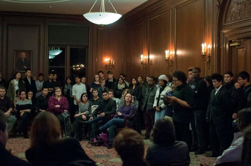 Friends and classmates listen Thursday night as speakers memorialize the life of former Northwestern student Alexis Lasker, who committed suicide Saturday. The intimate gathering, organized by her close friends, drew more than 100 attendees in Harris Hall.