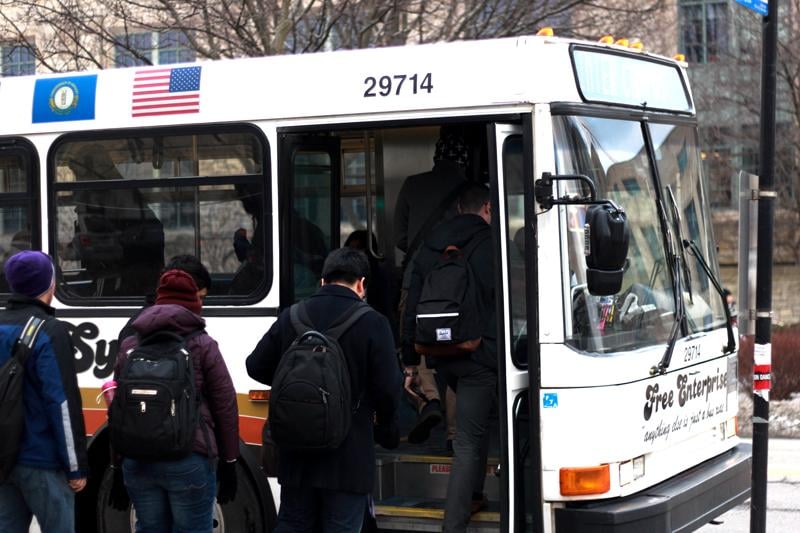 Students board a Northwestern shuttle. The Frostbite Express Shuttle operates when the wind chill factor is below zero or during blizzard conditions.