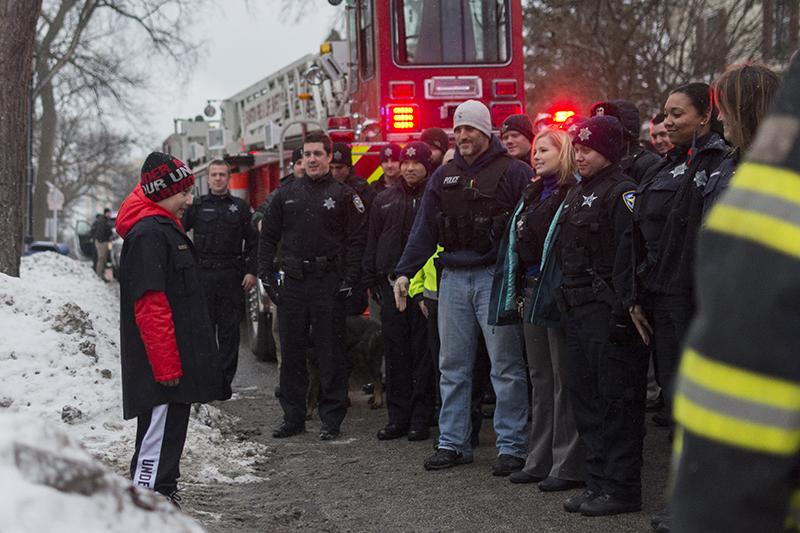 Staff+from+Evanston+Police+Department+and+Evanston+fire+department+gather+Thursday+afternoon+to+send+off+10-year-old+Julian+Sims+before+his+scheduled+bone+marrow+transplant.+Sims+was+diagnosed+with+leukemia+last+year.%0D%0A