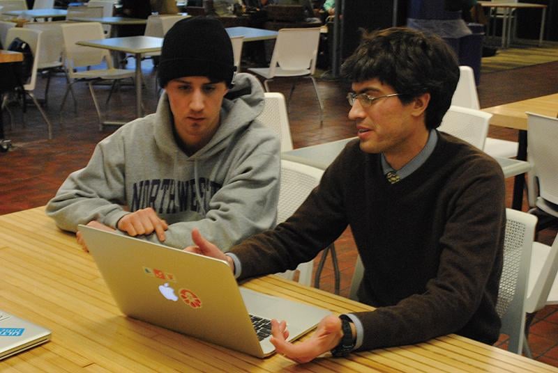 Secret Square developer Stephen Tarzia (right) discusses marketing strategy with the app’s marketing coordinator, Brennan Anderson. The messaging app focused on protecting users’ personal information.