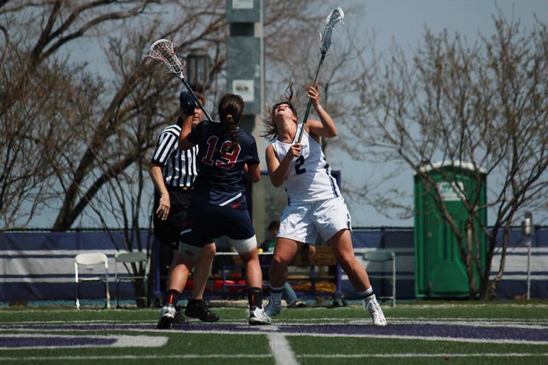 Senior draw specialist Alyssa Leonard reaches for the ball against Penn in last season’s Senior Day contest. Leonard pulled for 10 draw controls in Sunday’s season opener and now has the most career draw controls of any active Division I women’s player with 316. 