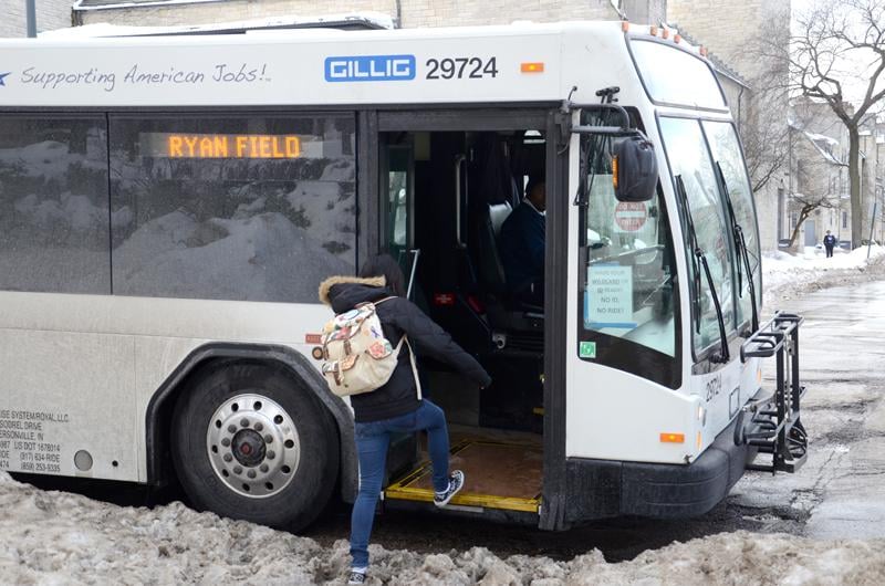 A student boards a shuttle Tuesday afternoon. Record low temperatures have forced Northwestern to run Frostbite shuttles more often this winter.
