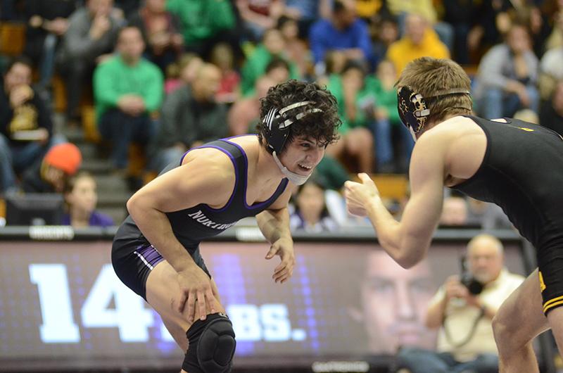 Junior Pat Greco takes on his Iowa opponent. Greco will be honored in Sunday’s Senior Day celebration, as he is graduating this spring to enroll in law school. 