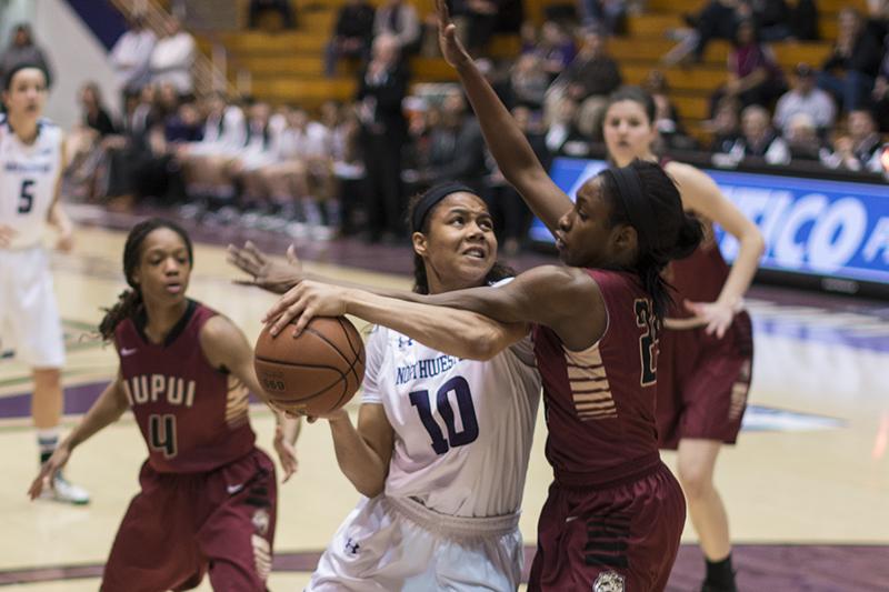 Forward Nia Coffey draws contact on her way to the rim. The freshman tallied 14 points, eight rebounds and five assists in Northwesterns blowout victory of IUPUI in the NIT on Sunday.