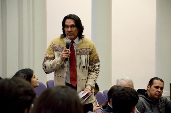 Andrew Johnson, executive director of the American Indian Center of Chicago, speaks at the Native and Indigenous Northwestern Community Forum Tuesday evening at Harris Hall. Johnson voiced his support for the efforts undertaken by the Native American and Indigenous Student Alliance to push NU toward a reconciliation process regarding John Evans’ role in the Sand Creek Massacre.
