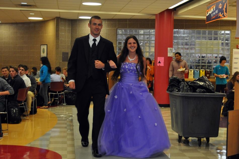 Evanston Township High School senior Olivia Wind models a Dreams Delivered dress on the runway in the school cafeteria. The Woman’s Club of Evanston created the Dreams Delivered program eight years ago to help girls save money during prom season.