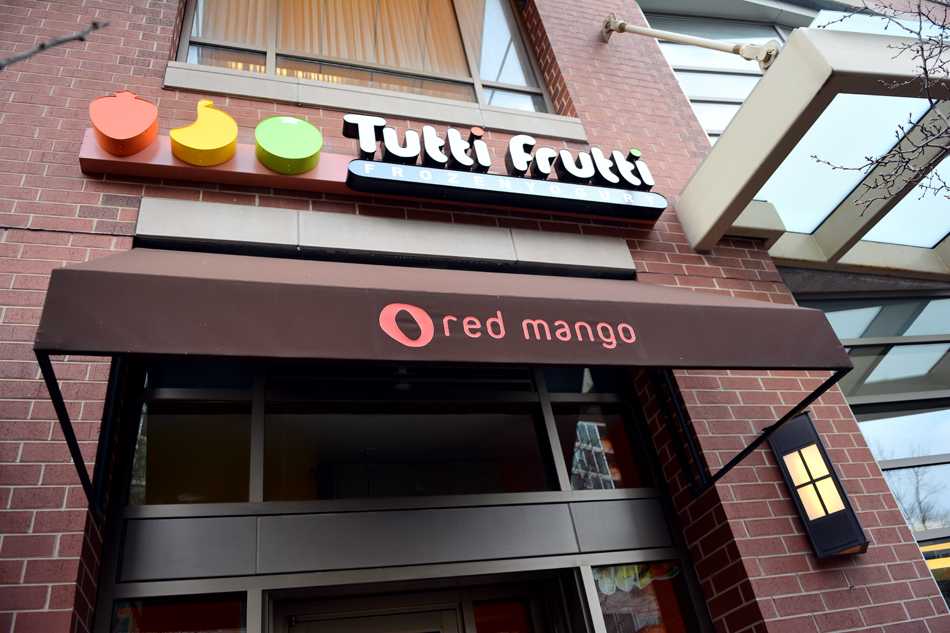 A sign hangs over the location of the soon-to-open Tutti Frutti frozen yogurt shop. Tutti Frutti, which will fill the space formerly occupied by Red Mango, is set to open next week.