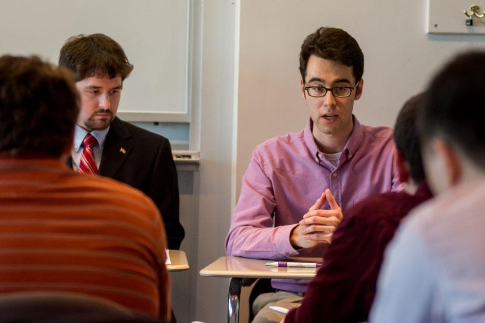 Dane Stier and David Friedman, members of College Republicans, discuss issues of income inequality at a student forum held Tuesday night. The event was organized as a collaboration between College Republicans, College Democrats and Quest Scholars.
