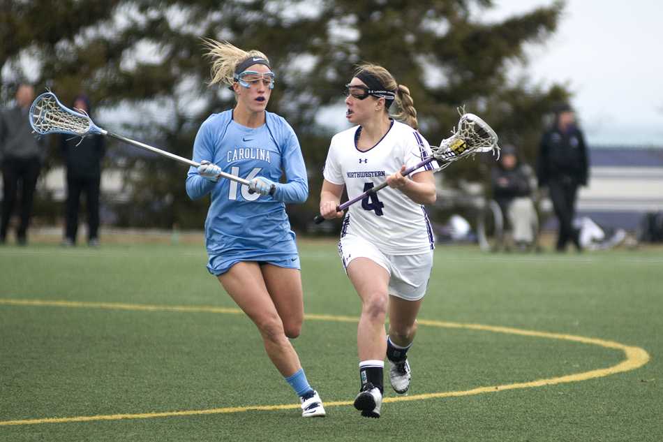 Senior Kat DeRonda goes up against a defender in the midfield. DeRonda had a fruitful weekend in Pennsylvania, leading Northwestern with 3 goals Friday against No. 10 Penn State and 2 goals Sunday in a win against No. 12 Pennsylvania. 