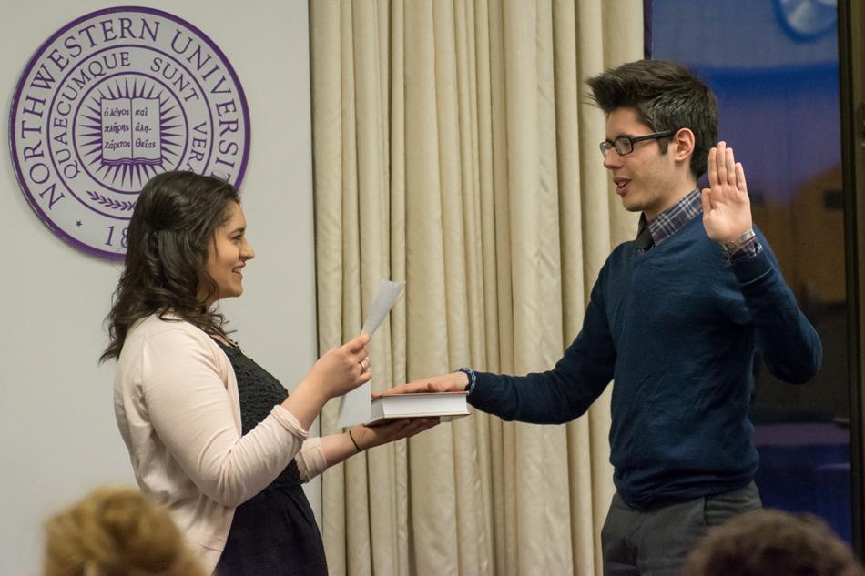 McCormick senior Abby Klearman swears in Weinberg junior Petros Karahalios as the Associated Student Government parliamentarian for the coming year. Klearman served as parliamentarian the past year.