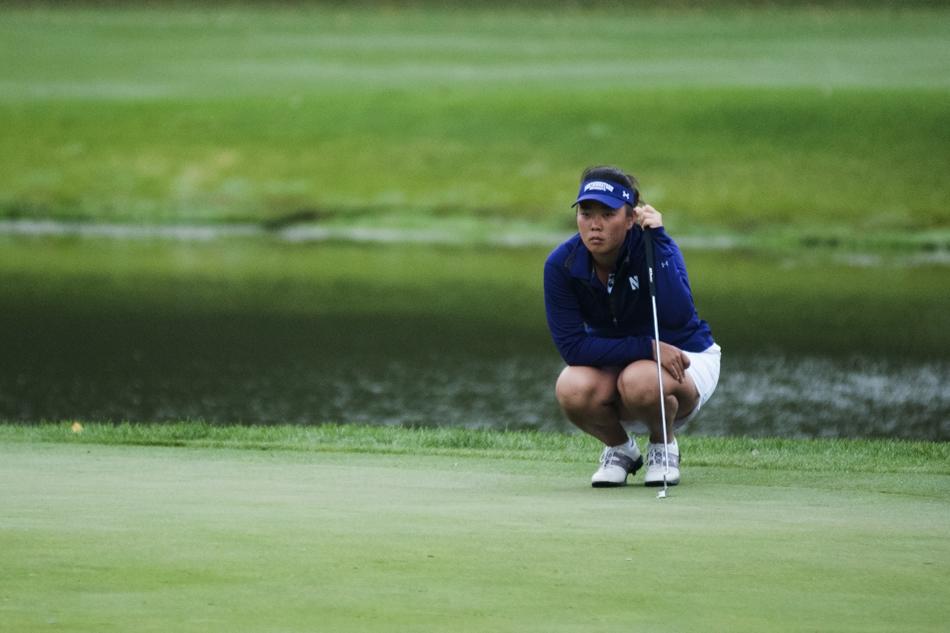 Hana+Lee+intently+looks+over+a+putt.+The+junior+fired+a+6-under-par+66+on+the+way+to+co-medalist+honors+in+the+stroke+play+portion+of+the+Liz+Murphey+Collegiate+Classic.