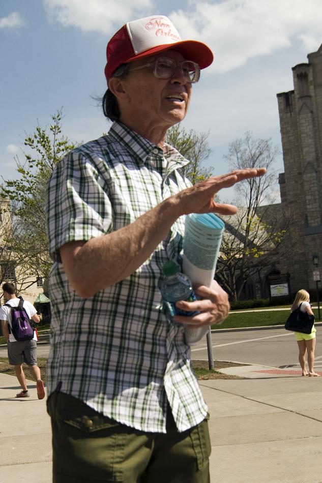 Wayne Lela, founder of Heterosexuals Organized for a Moral Environment, hands out flyers about his views at The Arch on Thursday. Lela has come to Northwestern in the past and is focused on spurring conversation and voicing his opinions on homosexual rights. 