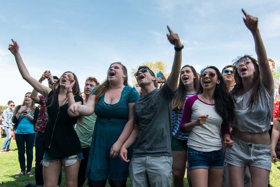 Students cheer for the artists during A&O Productions and Dance Marathons annual Benefit Concert held on Norris University Centers East Lawn. This years concert featured synth rock band Magic Man and indie rock band Cheers Elephant.